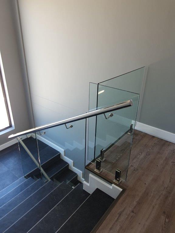 12 mm Clear glass + 50 mm dia mounted hand rail 12 mm Clear glass + 50 mm dia mounted hand rail
