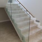 12 mm Clear glass + 50 mm dia mounted hand rail 12 mm Clear glass + 50 mm dia mounted hand rail